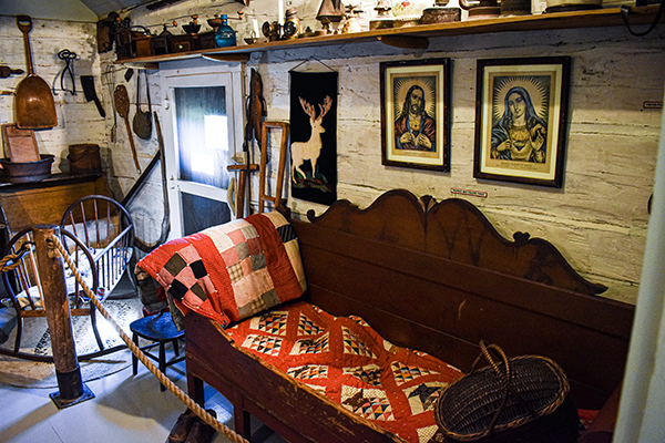 Inside of the Old Sailor's Home with a couch and portraits on the wall