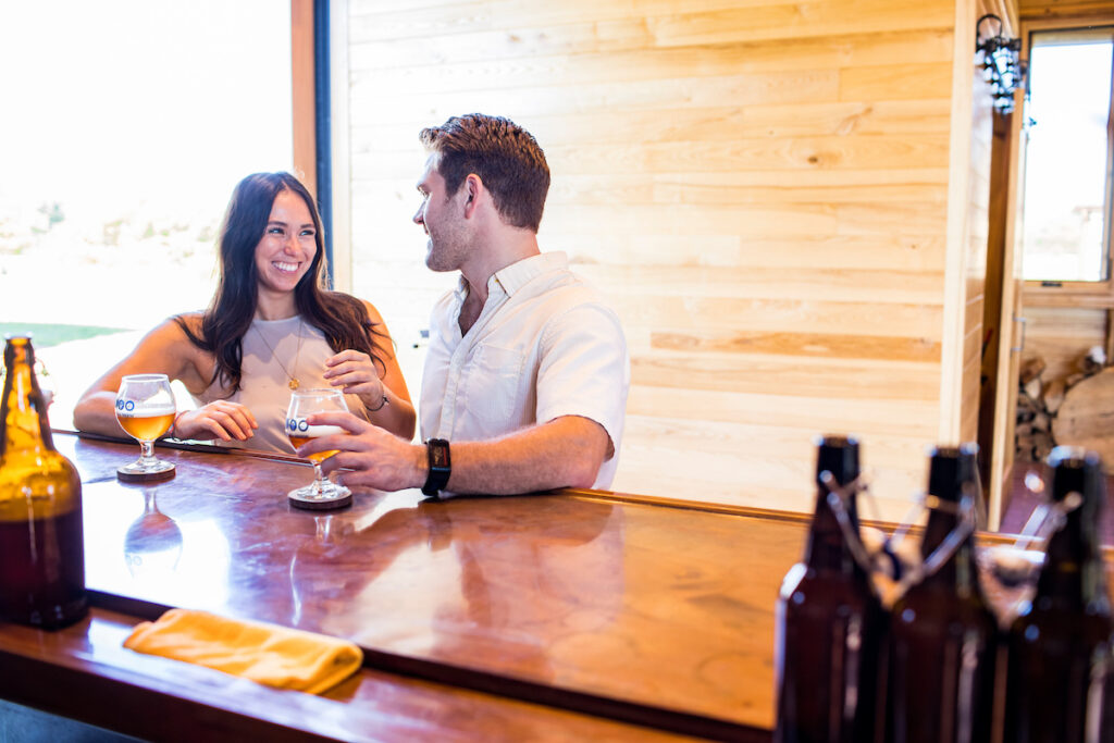 A couple explores beer and brewing in the Brewhouse. OWW Summer Photoshoot 2022